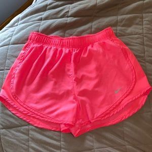 Bright pink Nike shorts